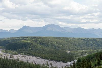 Scenic view of mountains against cloudy sky