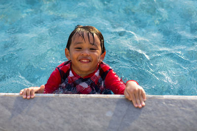 Portrait of smiling girl in swimming pool