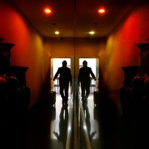 Silhouette of woman in corridor
