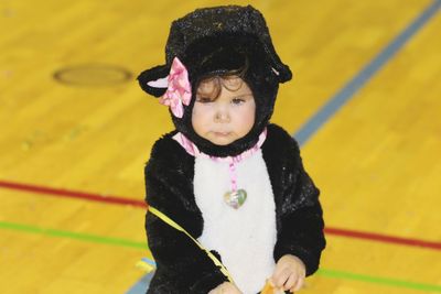 High angle view of cute baby girl wearing costume