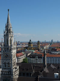 View of buildings in city against clear sky