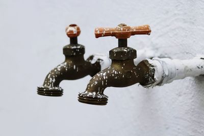 Close-up of faucet in water