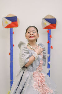 Portrait of young woman with philippines flag
