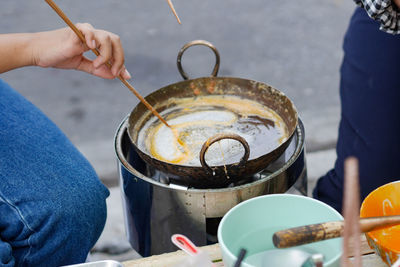 Midsection of man preparing food