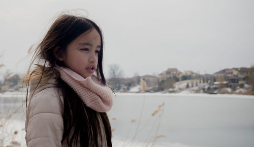 Portrait of girl standing in snow