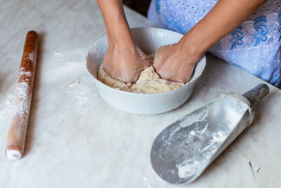 Cropped hand of person preparing food