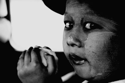 Close-up of boy with face paint