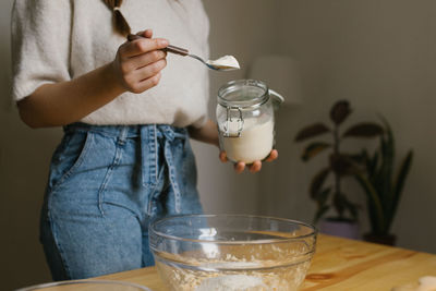 Young woman making christmas cookies