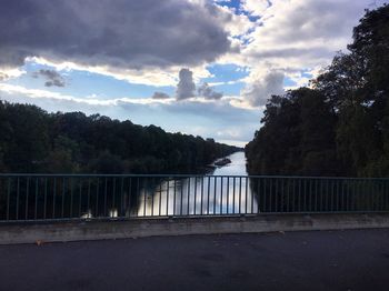 View of calm lake against trees