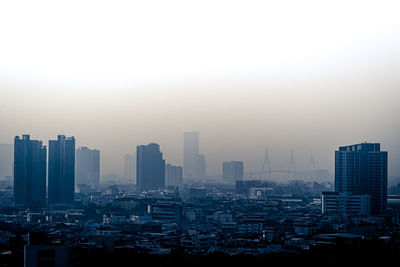 Modern buildings in city against sky