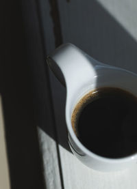 High angle view of coffee cup on table