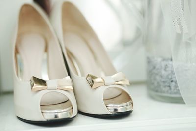 Close-up of shoes on table