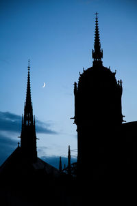 Silhouette of temple building against sky