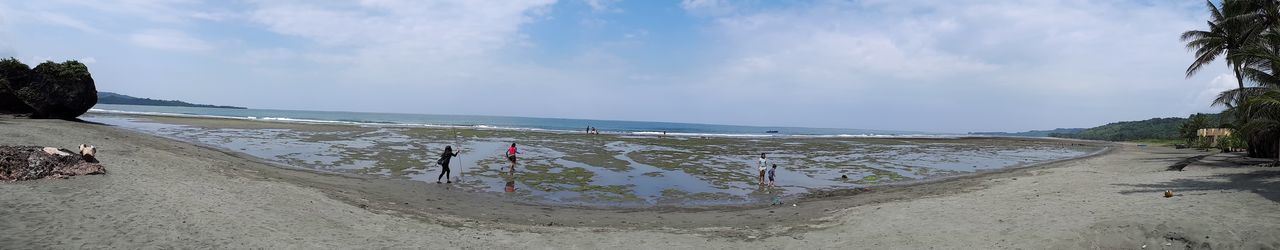 Panoramic view of beach against sky