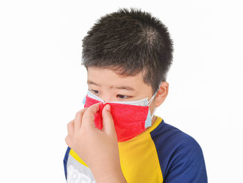 Portrait of boy against white background