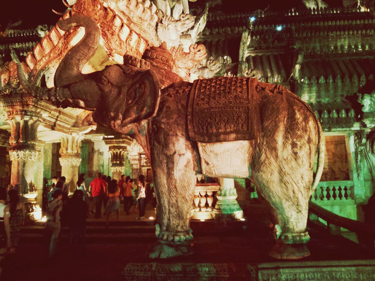 night, illuminated, indoors, religion, built structure, cultures, tradition, art and craft, architecture, art, temple - building, human representation, decoration, creativity, place of worship, animal representation, spirituality, sculpture, statue