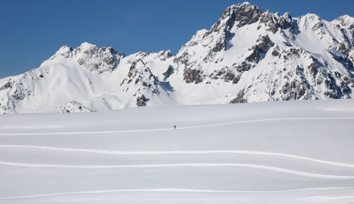 Alpine landscape in winter at alpe d'huez with the mountains covered in snow