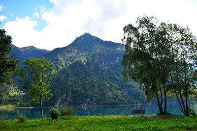 Scenic view of lake and mountains against sky