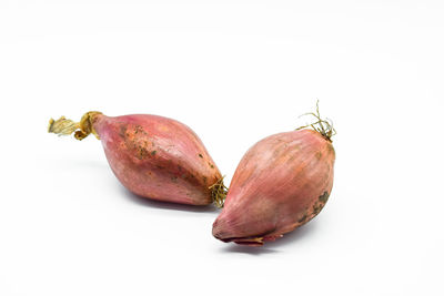 Close-up of pomegranate against white background