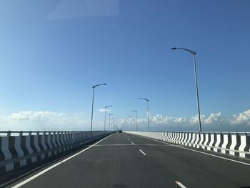 View of bridge over road against sky