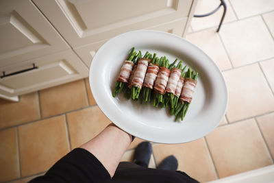 High angle view of person having food in kitchen