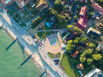 High angle view of swimming pool by buildings in city