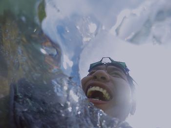 Close-up of man swimming in sea