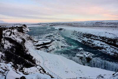 Scenic view of sea against sky during winter