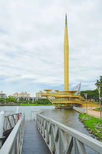 Bridge over river against buildings in city