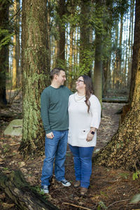 Cute couple laughing, looking at one another.