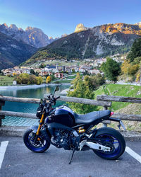 Rear view of man riding motorcycle on road