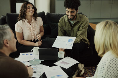 Group of business people having meeting in lobby