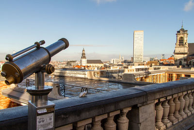 Buildings in city against clear sky