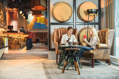 Adult women resting in cozy cafeteria