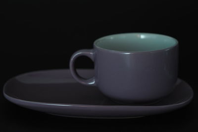 Close-up of coffee cup on table