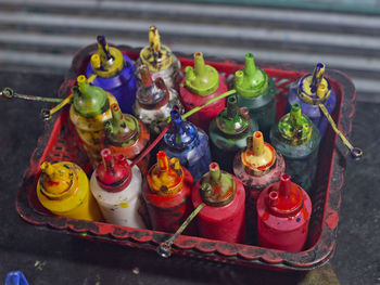 High angle view of multi colored spray bottles