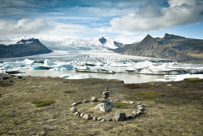 Panoramic view of sea and mountains against sky