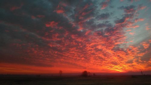 Scenic view of dramatic sky during sunset