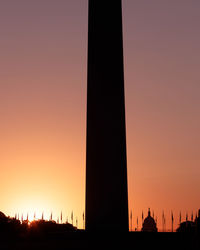 Silhouette of building during sunset