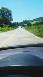 Road seen through car windshield