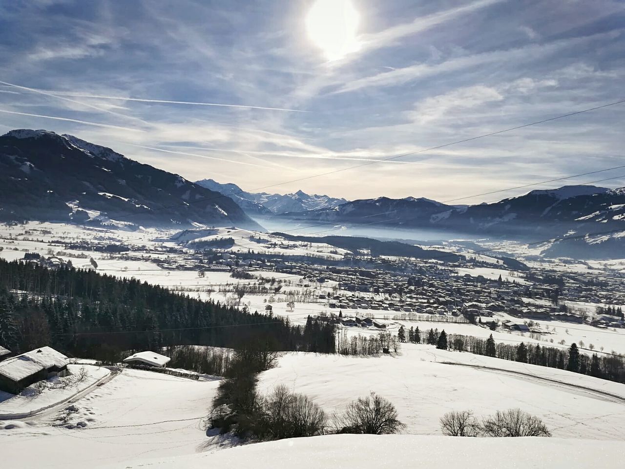 winter, cold temperature, snow, mountain, scenics - nature, beauty in nature, environment, tranquil scene, tranquility, sky, mountain range, landscape, nature, tree, cloud - sky, non-urban scene, day, plant, covering, snowcapped mountain, no people, ski resort