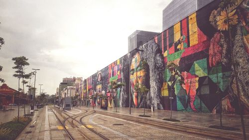 Street amidst buildings in city against sky