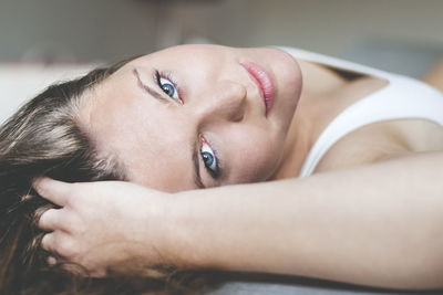 Portrait of young woman lying down