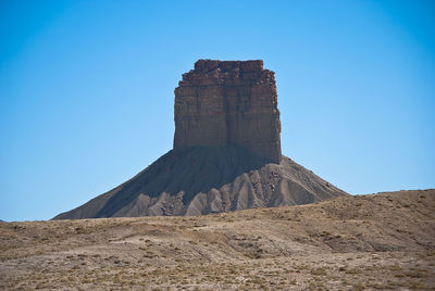 Low angle view of fort against clear blue sky