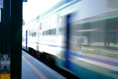 Blurred motion of train at railroad station