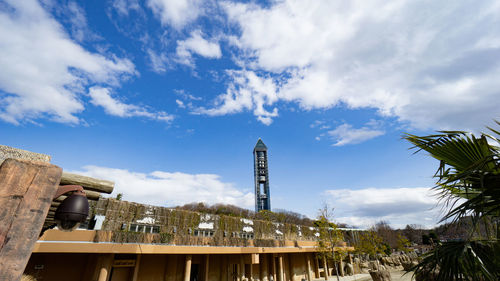 Higashiyama zoo and botanical gardens with higashiyama sky tower in cloudy blue sky day