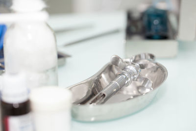 Close-up of surgical equipment on table at hospital