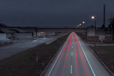 High angle view of light trails on road at dusk