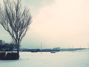 Scenic view of frozen landscape against sky