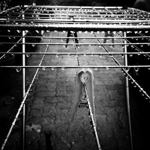 Low angle view of child hanging on rope